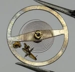 Swiza 25-26 Balance Wheel Complete And Spring 186 Watch Movement Parts Nos. Fixed Price $18.74.