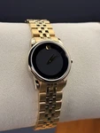 New Movado Museum Women Gold Tone Black Dial 28MM Watch 0607005. Fixed Price $314.92.