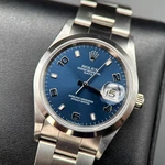 Rolex Oyster Perpetual Date 15200 Blue Dial 34MM Automatic Watch - 2005. Fixed Price $6999.00.