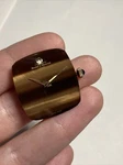 Baume & Mercier Cal 1050 17J S Watch Movement W/ Tiger Eye Dial. Fixed Price $850.00.