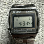 Vtg Lorus Men's Watch Silver Brown Digital Alarm Chrono Y789-5000 New Battery. Fixed Price $35.95.
