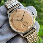 1945 Longines Salmon Dial Cal. 12.68Z Stainless Steel Small Seconds Wristwatch. Fixed Price $1499.00.