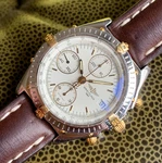 Breitling Chronomat B13050 Chronograph - White Dial 18K & Steel 39MM Wristwatch. Fixed Price $2499.00.