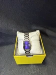 Invicta Women's Wildflower Quartz Watch Silver Tone Dial, Purple Crystal Bezel. Fixed Price $38.50.