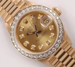Rolex Lady Datejust 26MM 18K President Diamond Bezel Champagne Dial. Fixed Price $15000.00.