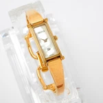 Gucci 1500 Gold Shell Quartz Rectangle Womens Bangle Watch Mother Of Pearl 5.5. Fixed Price $175.00.