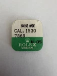 Authentic Rolex Cal 1530 Part 7869 Stem. Fixed Price $75.00.